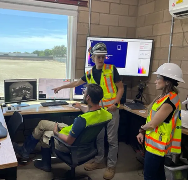 Heliogen workers in control room